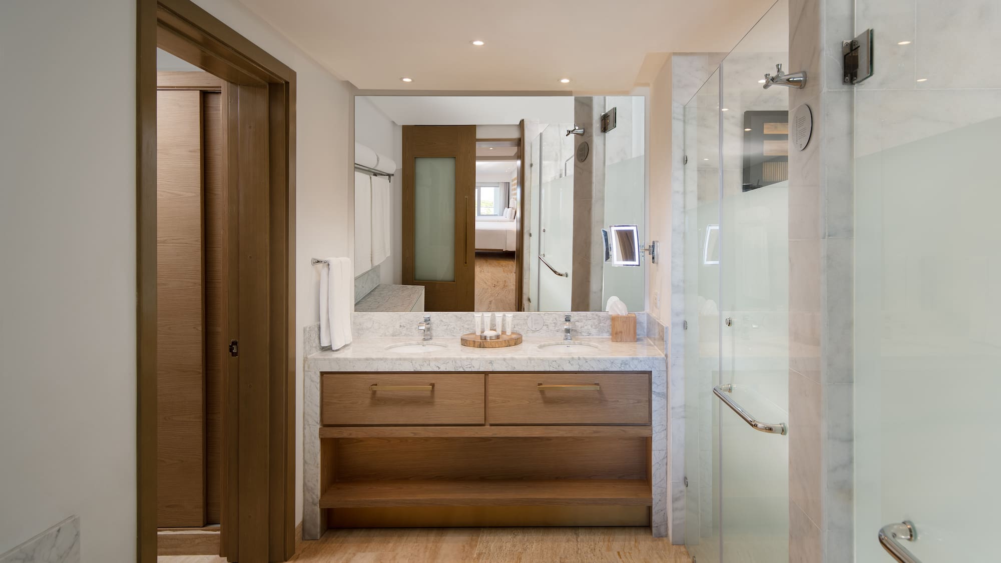 a bathroom with a marble countertop and a shower