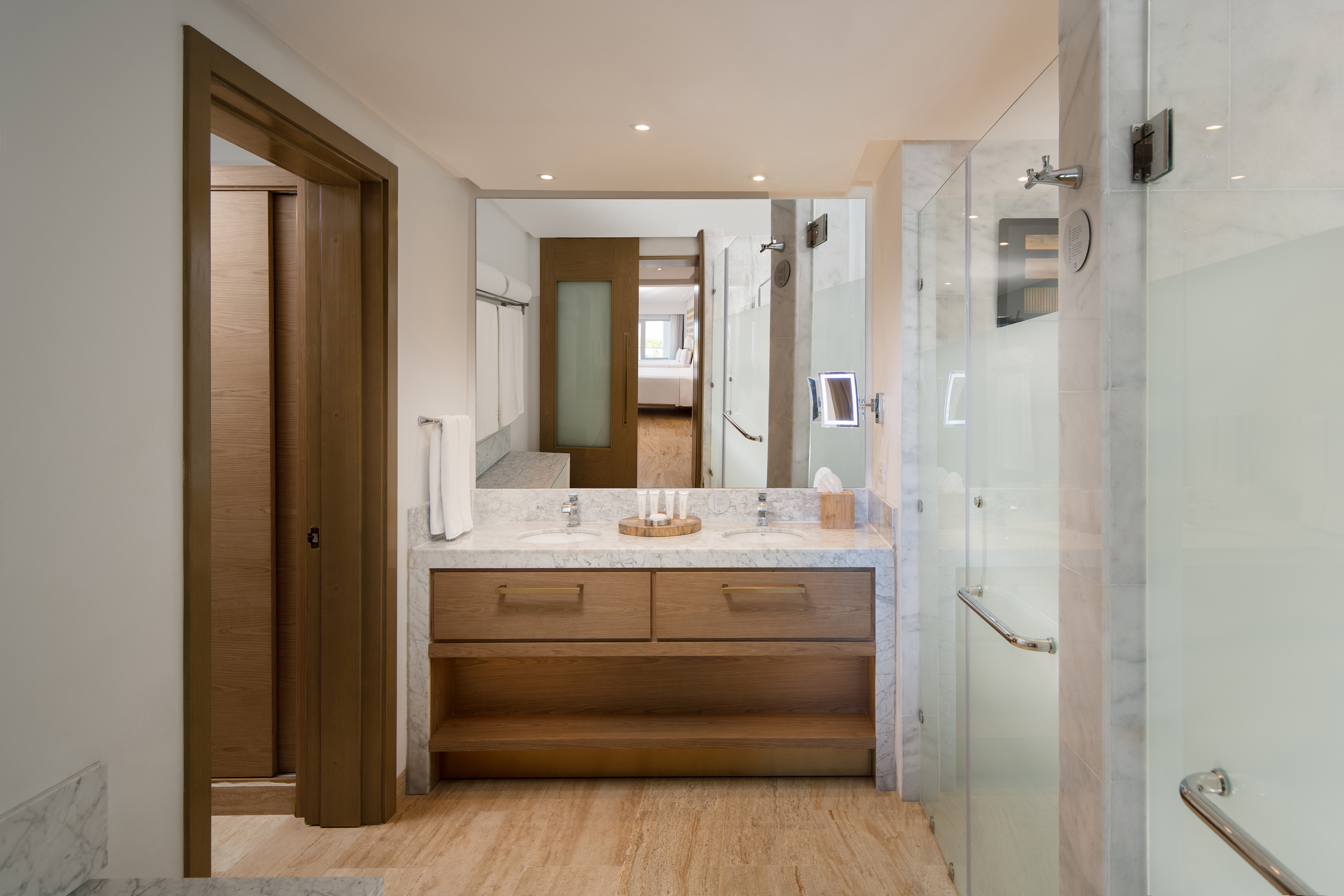 a bathroom with a marble countertop and a shower
