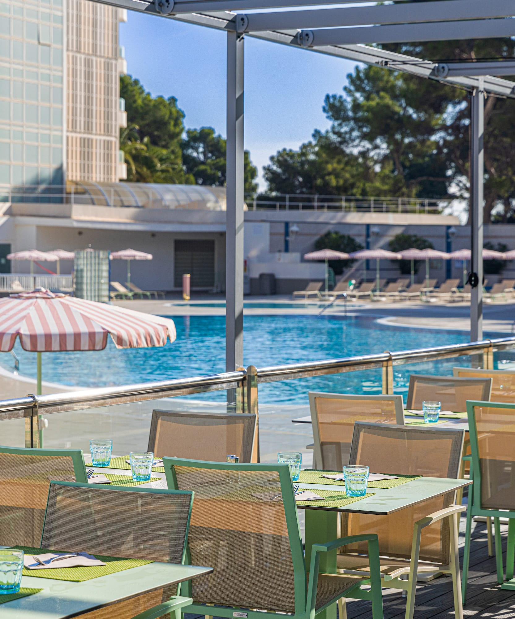 a pool with tables and chairs