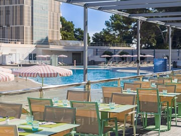 a pool with tables and chairs