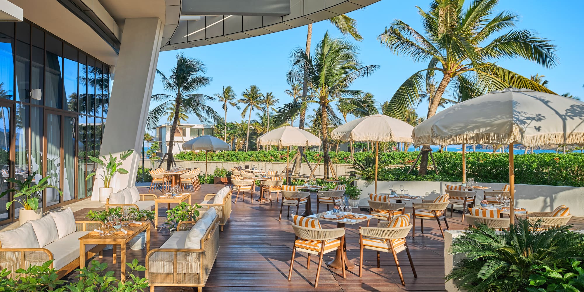 a patio with chairs and umbrellas