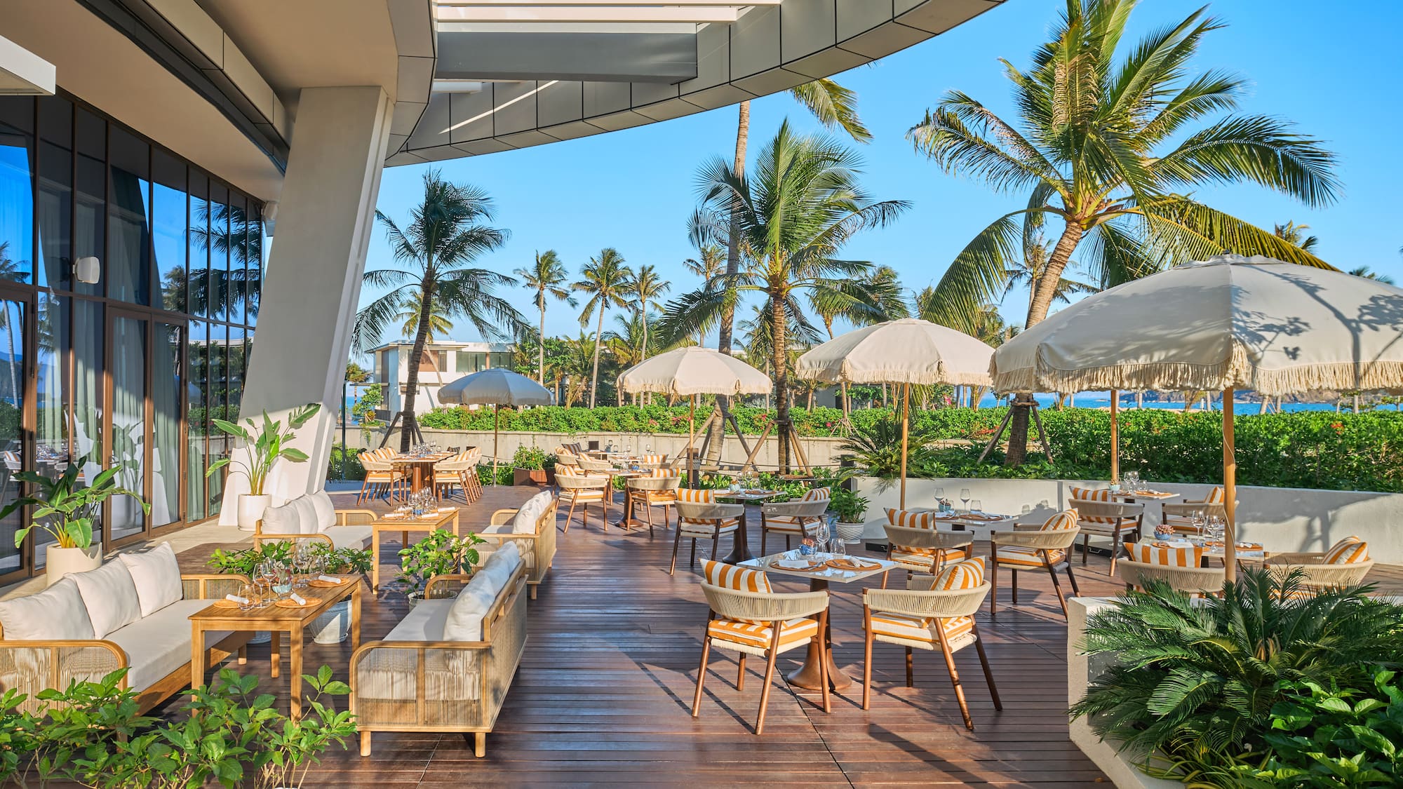 a patio with chairs and umbrellas