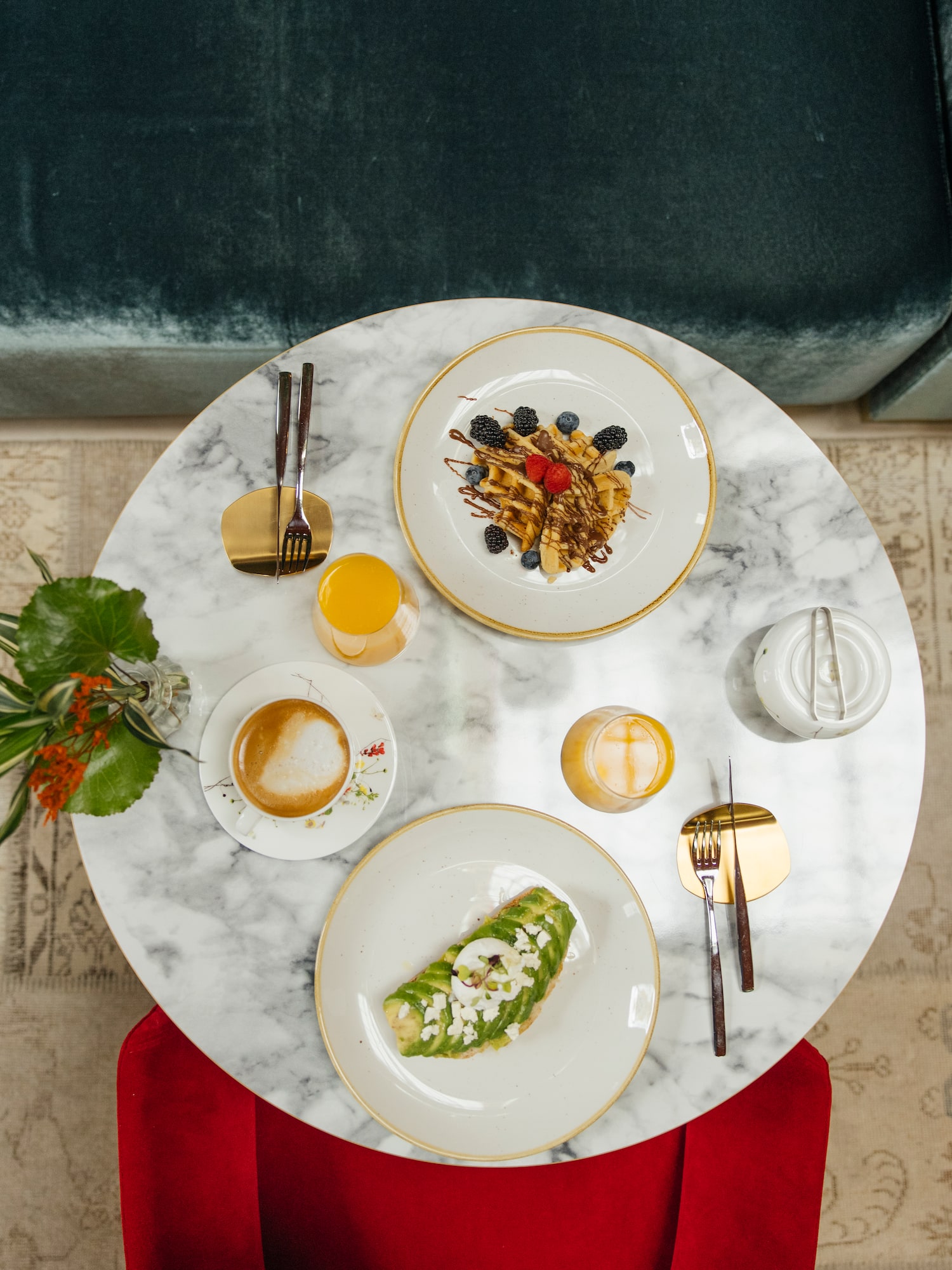 a table with plates of food and drinks