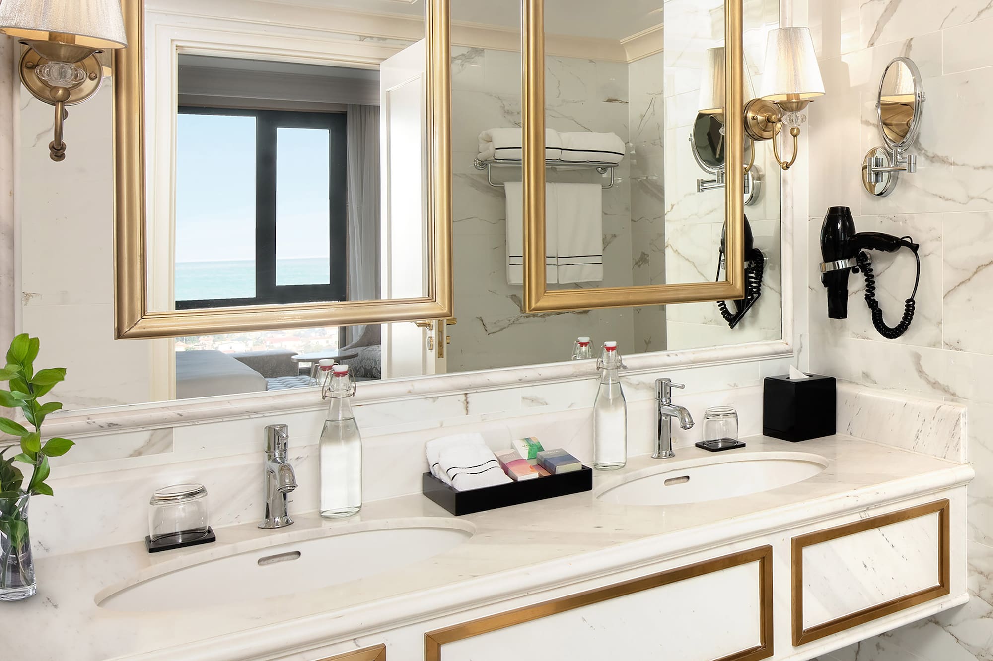a bathroom with a large mirror and two sinks