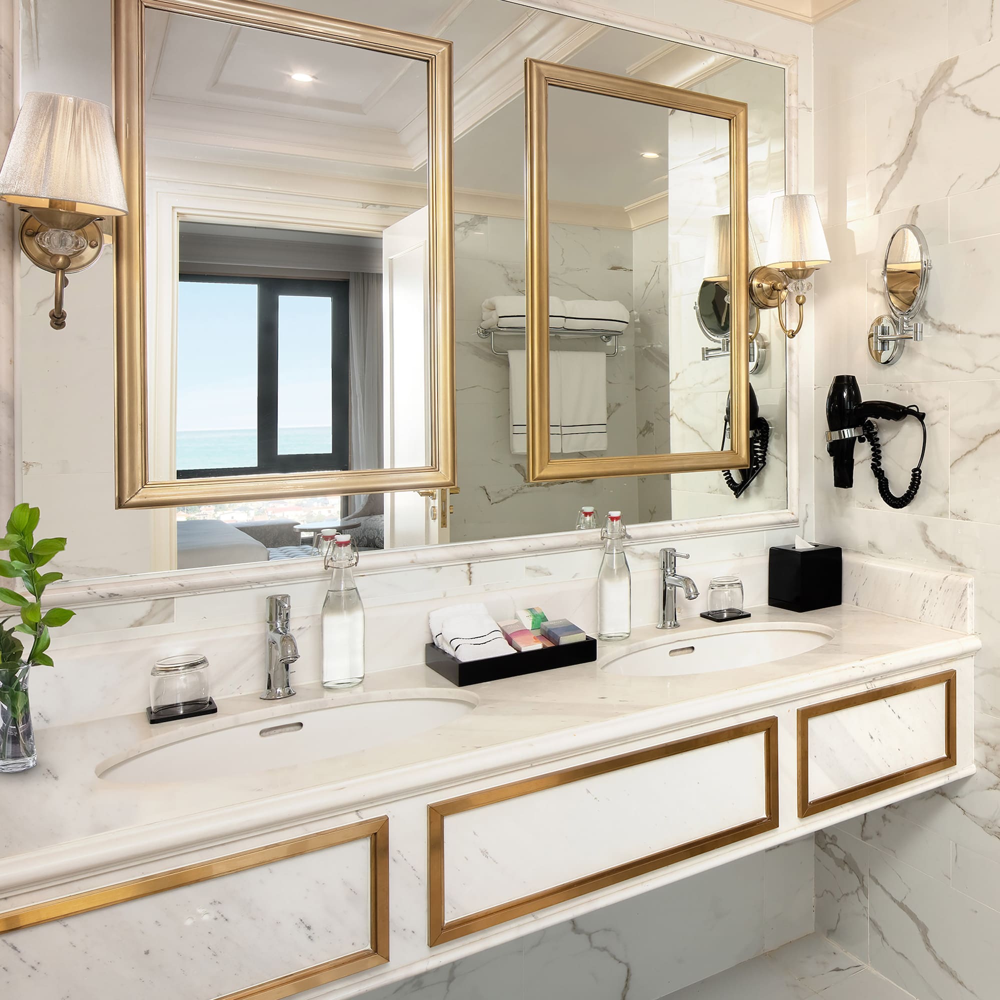 a bathroom with a large mirror and two sinks
