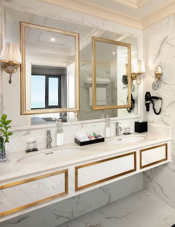 a bathroom with a large mirror and two sinks