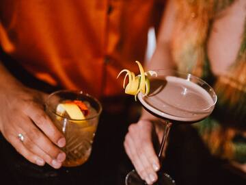 a person holding a drink