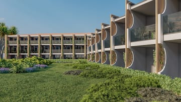 a building with a lawn and plants