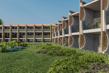 a building with a lawn and plants