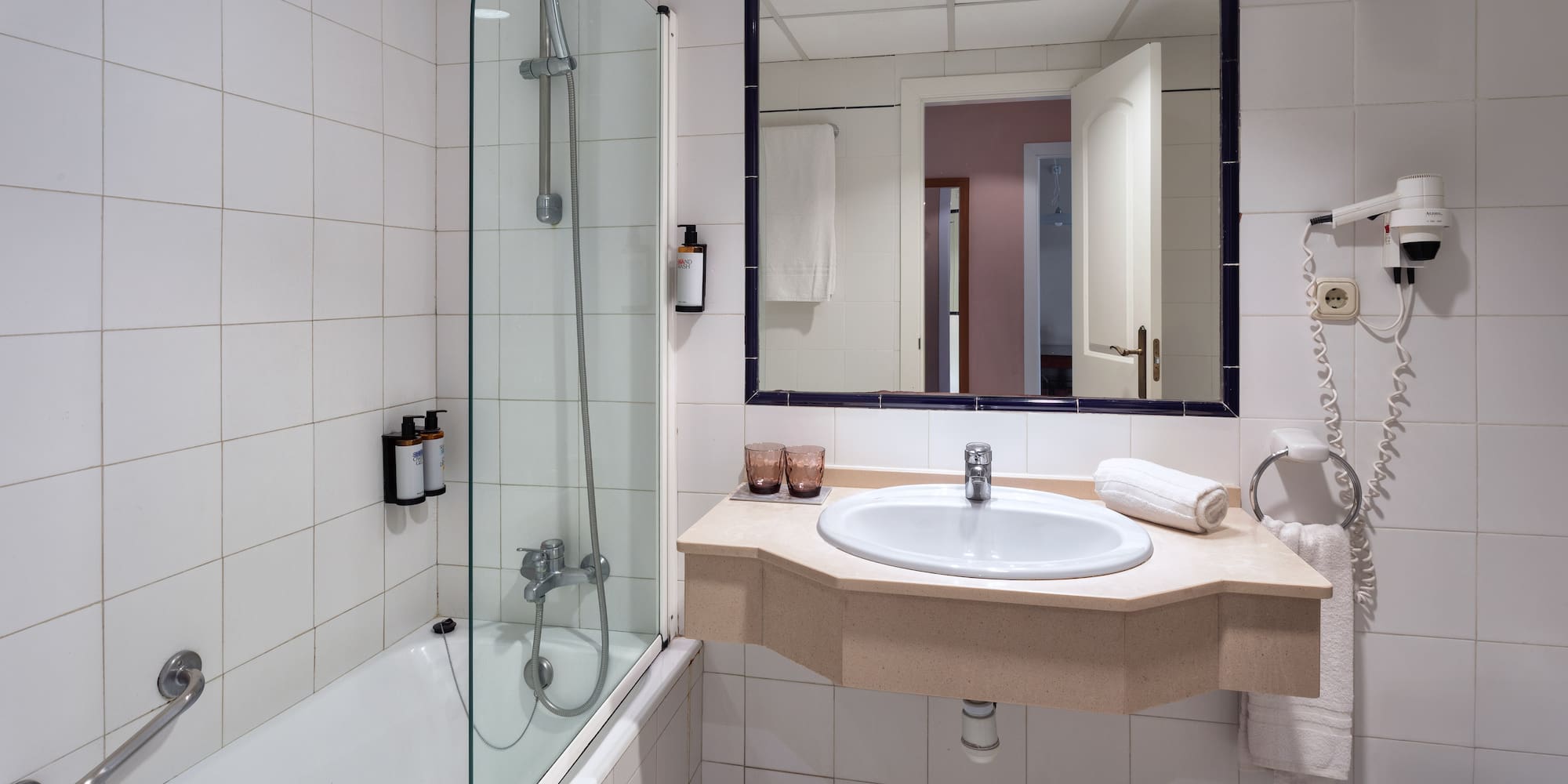 a bathroom with a sink and shower