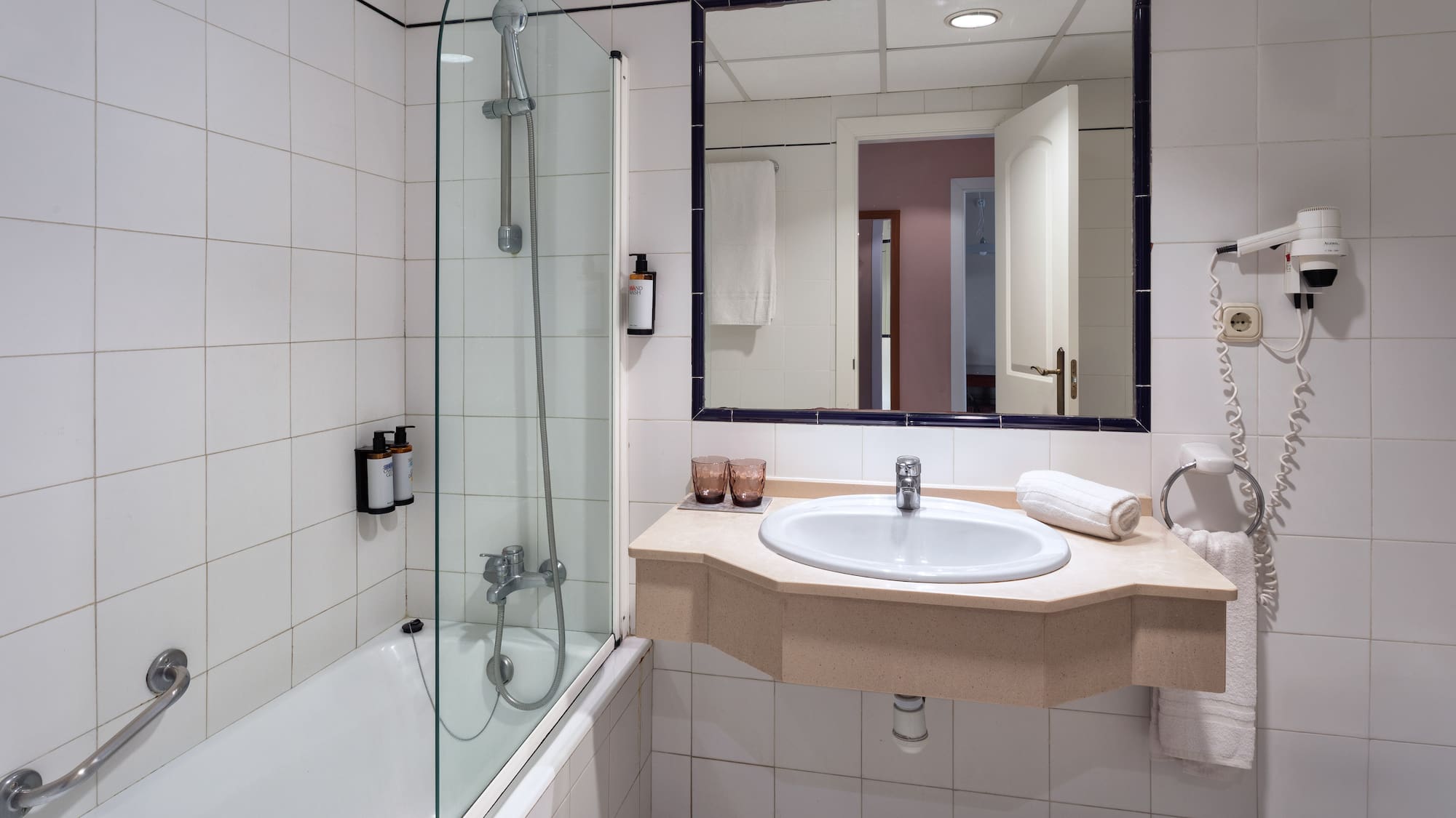 a bathroom with a sink and shower