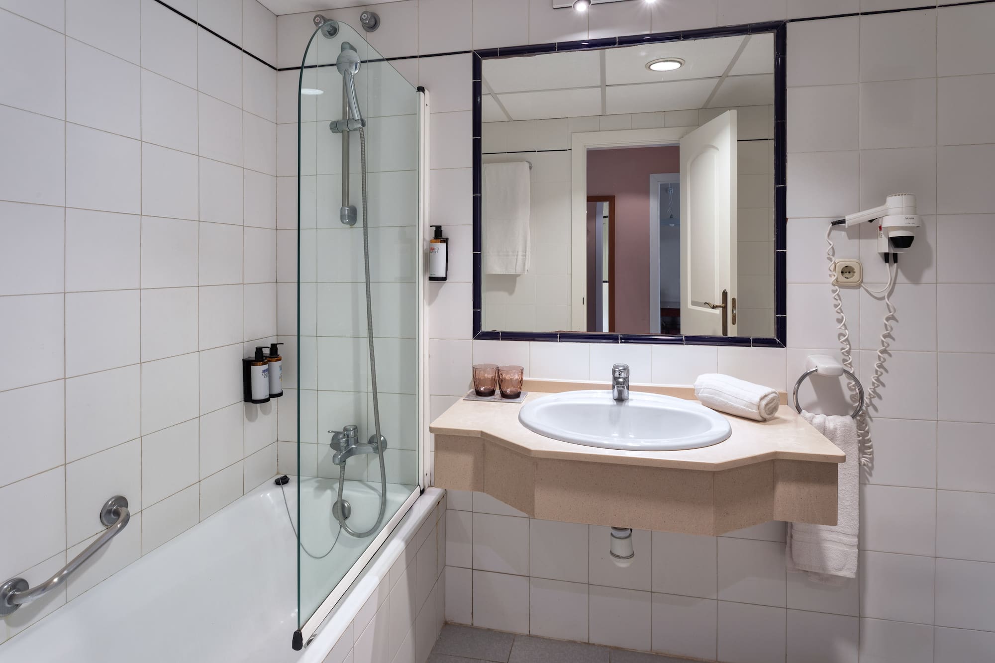 a bathroom with a sink and shower