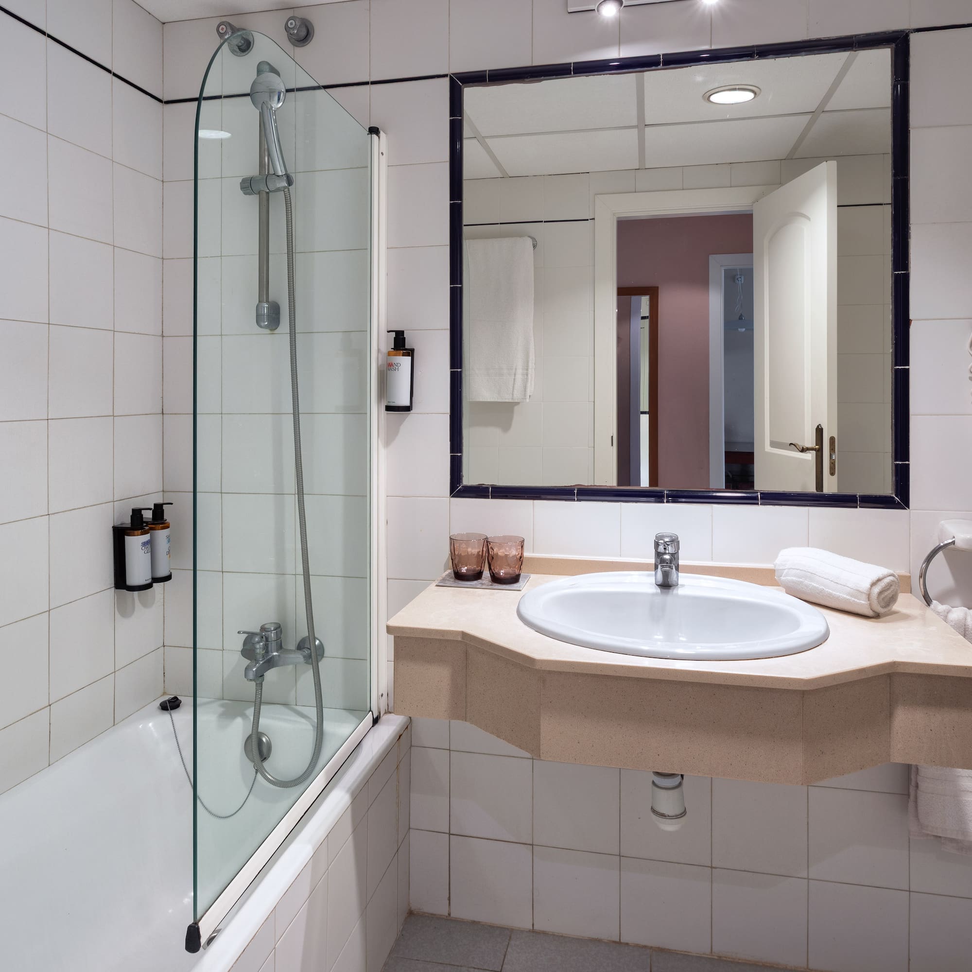 a bathroom with a sink and shower