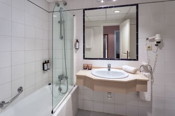 a bathroom with a sink and shower