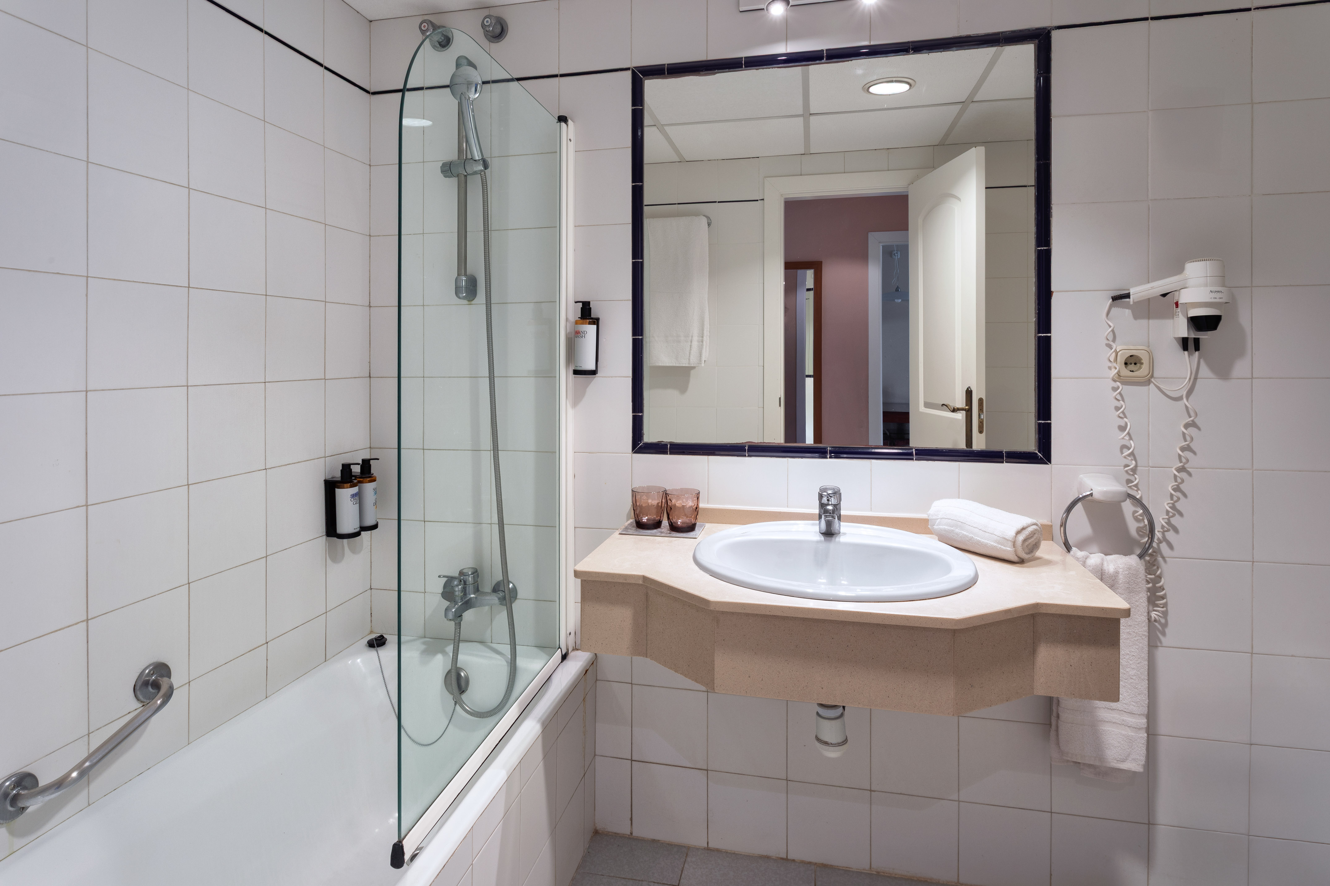 a bathroom with a sink and shower