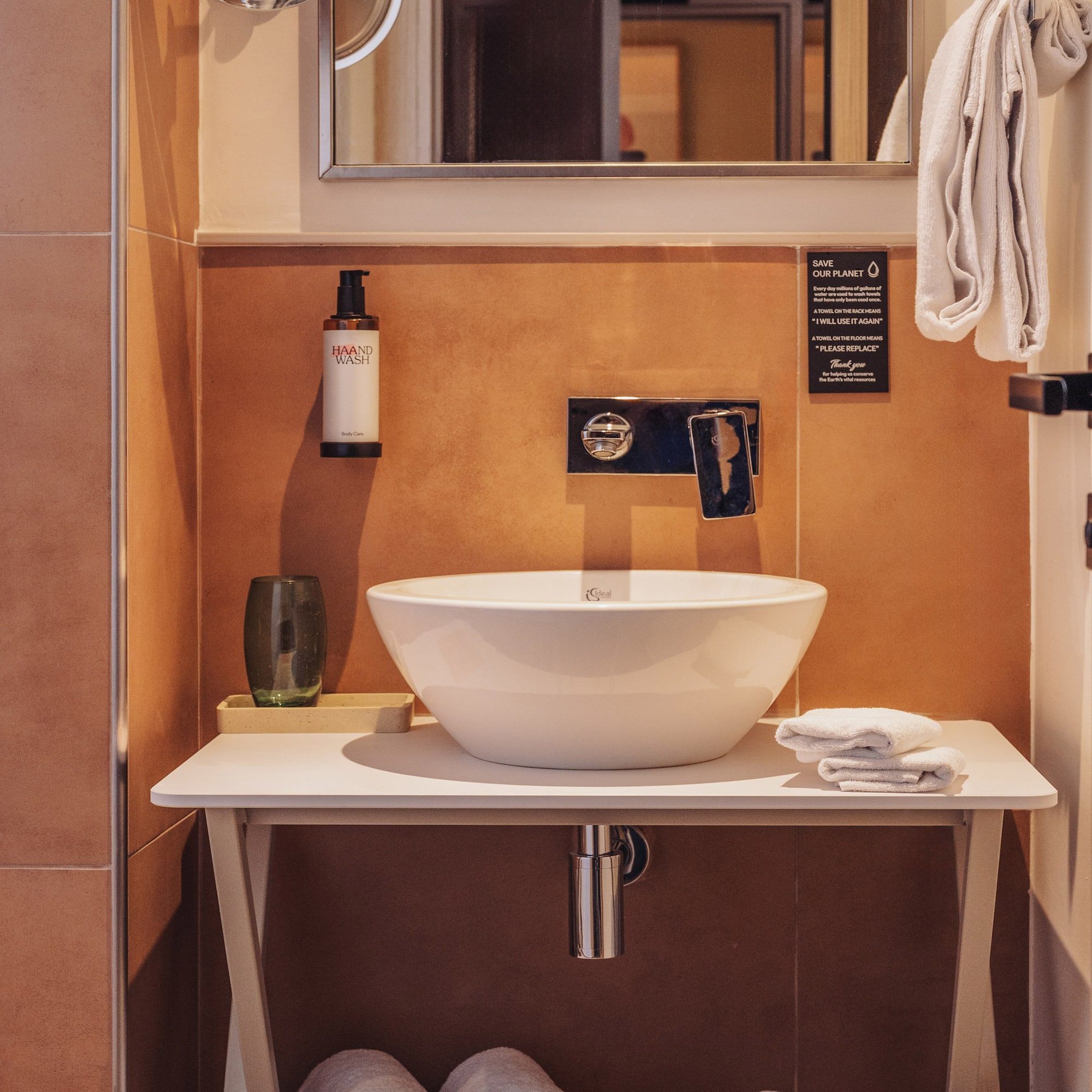 a sink and mirror in a bathroom