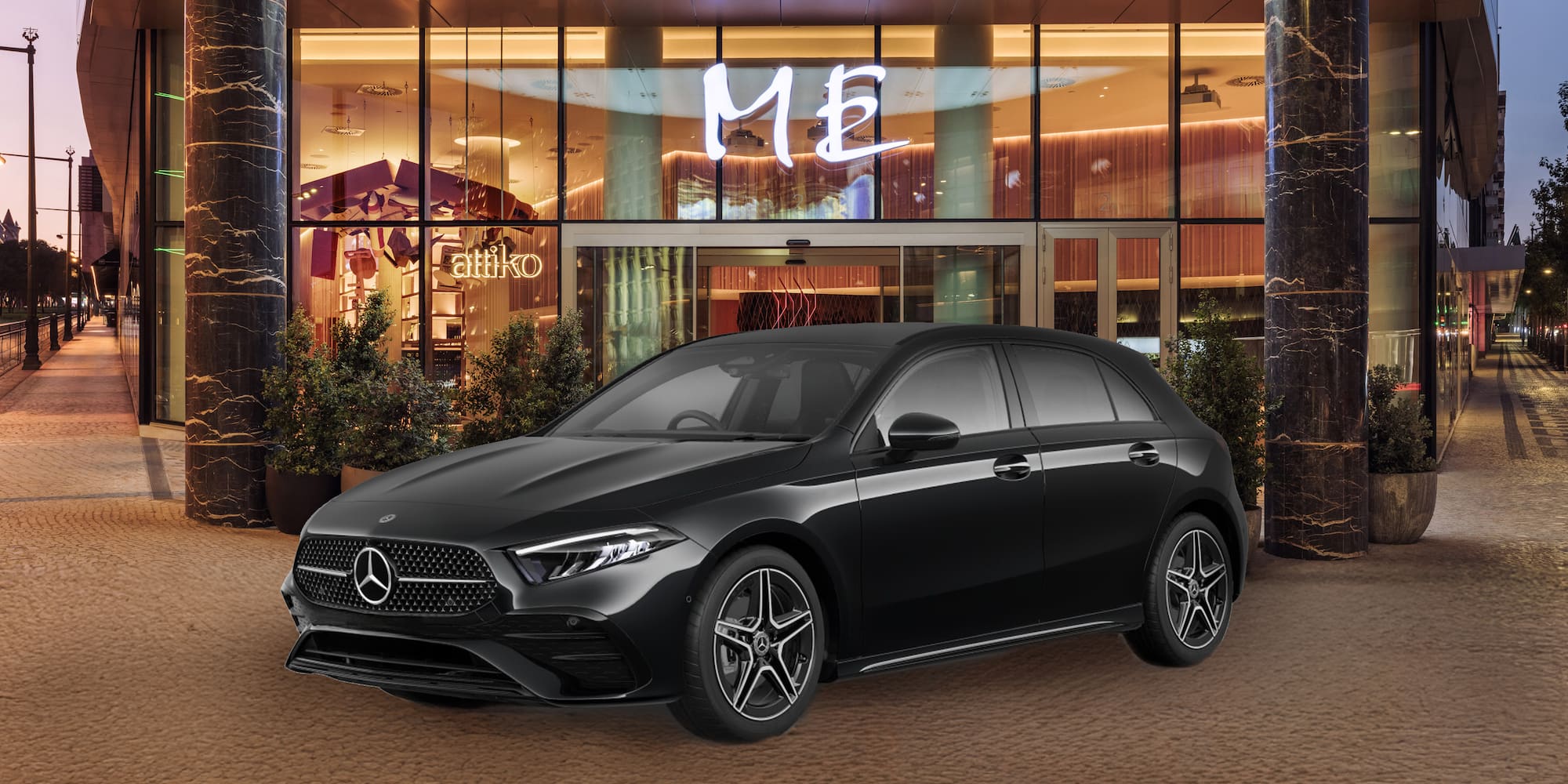 a black car parked in front of a building