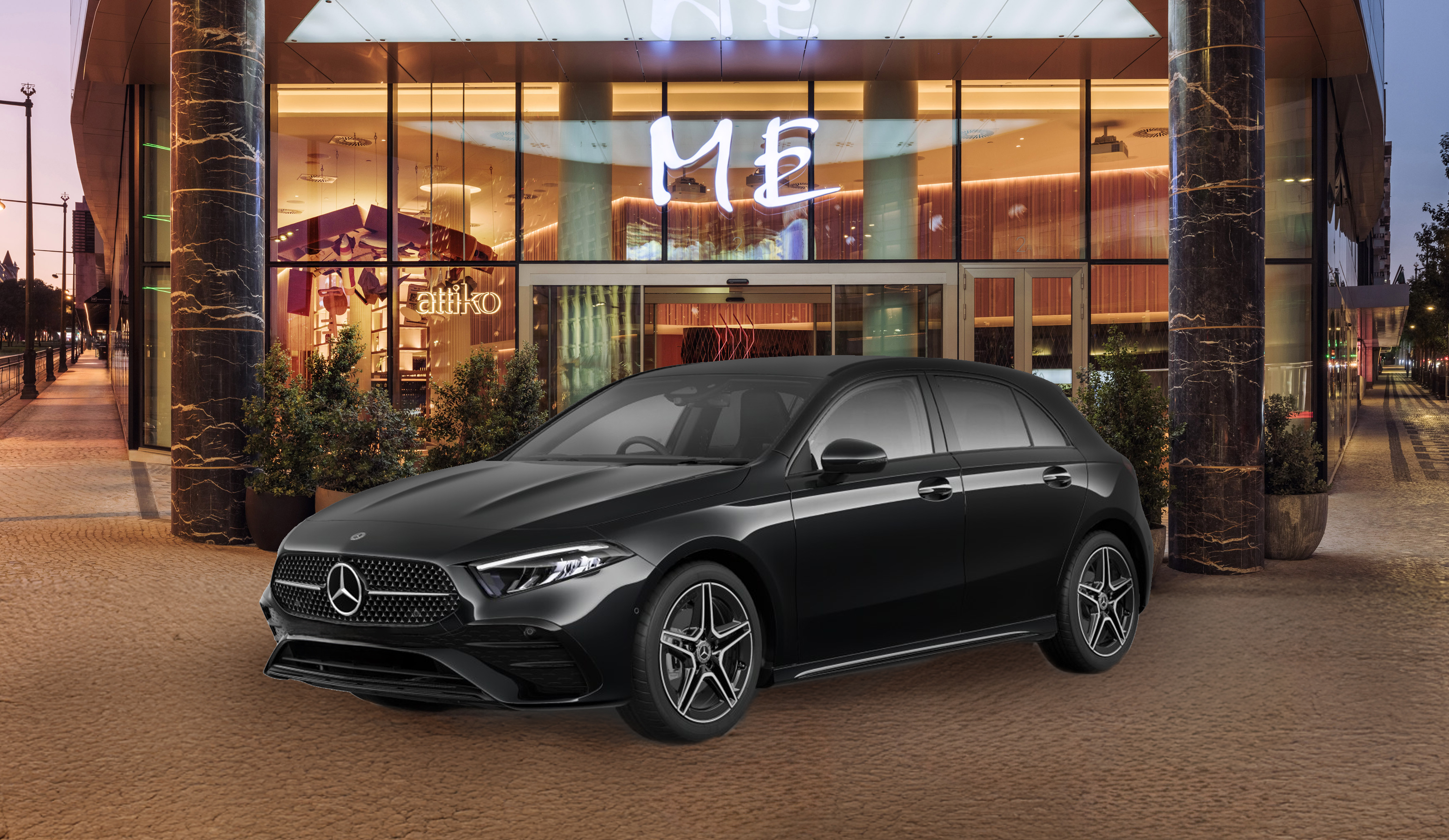 a black car parked in front of a building