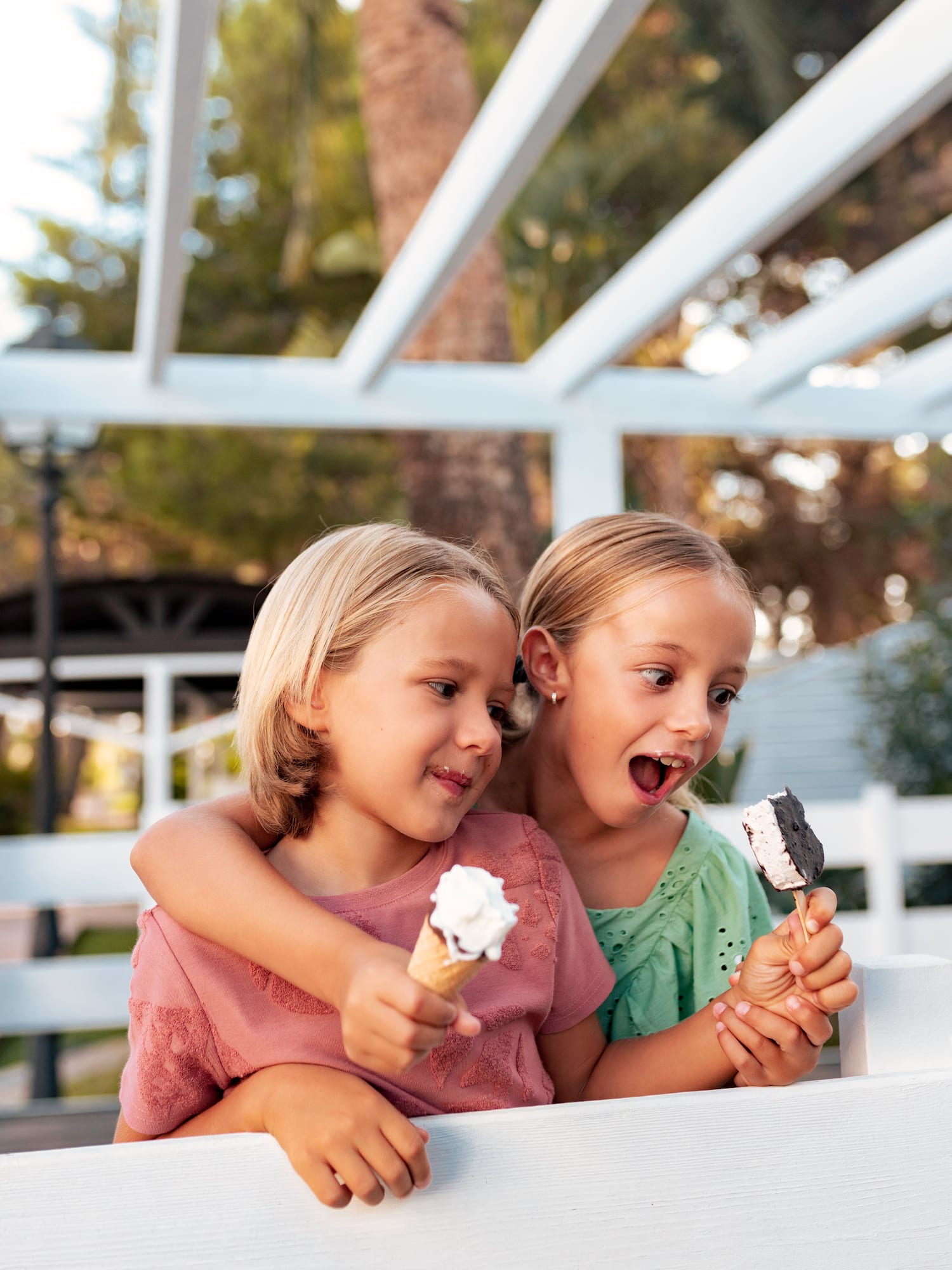 two girls holding ice cream cones