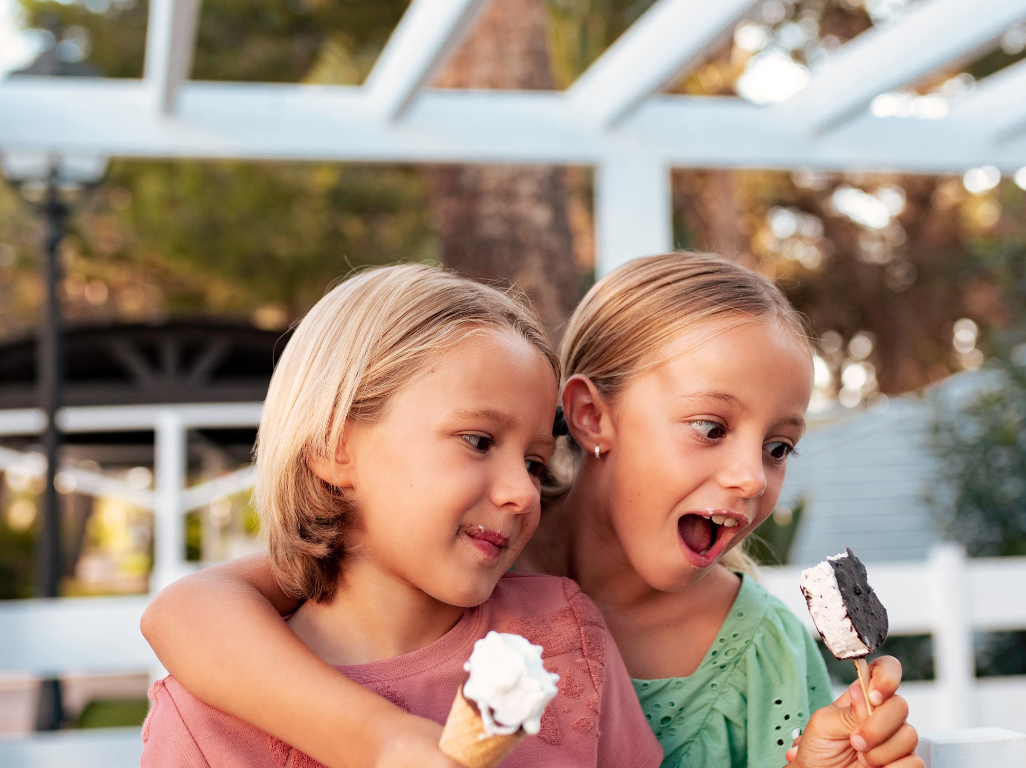 two girls holding ice cream cones