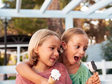 two girls holding ice cream cones