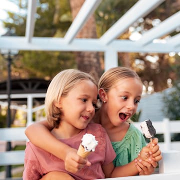 two girls holding ice cream cones