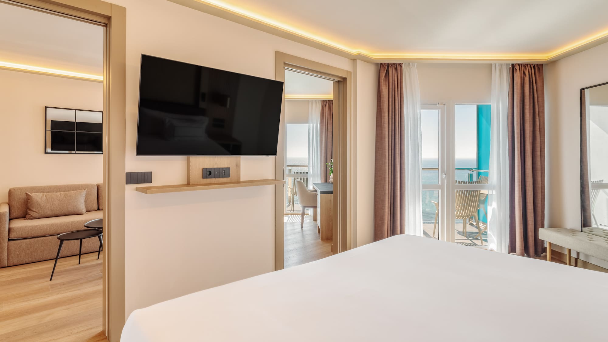 a room with a television and a balcony