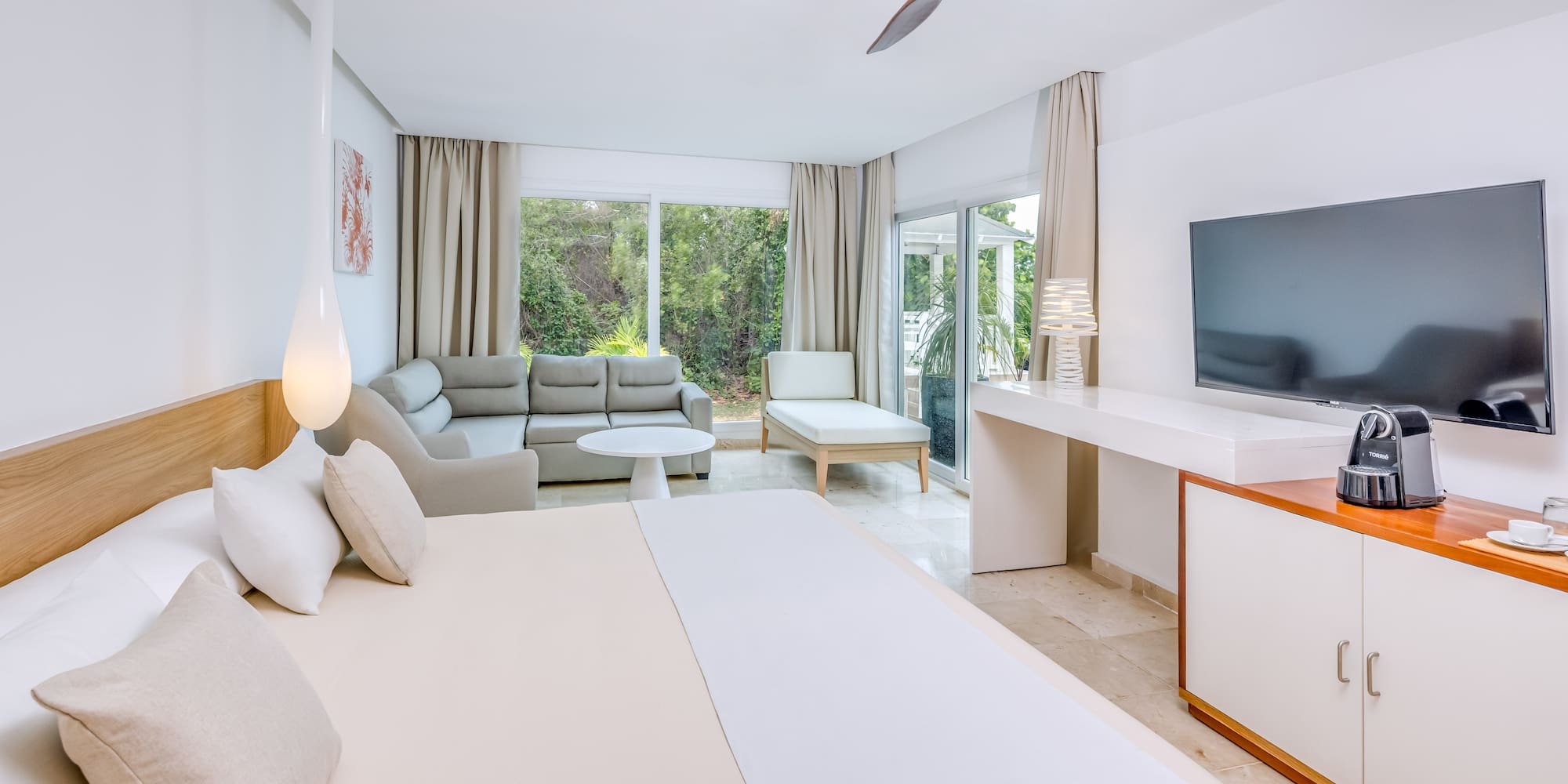 a room with a television and a bed