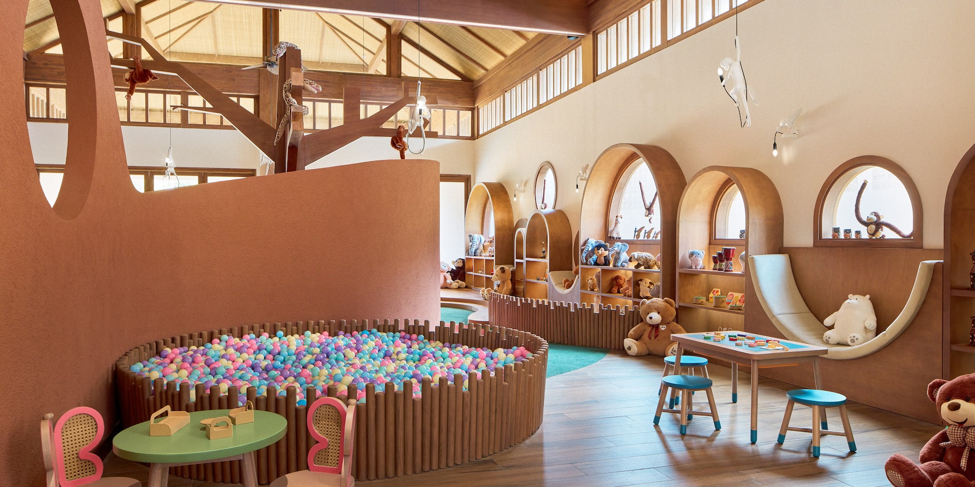 a room with a play area and a play slide