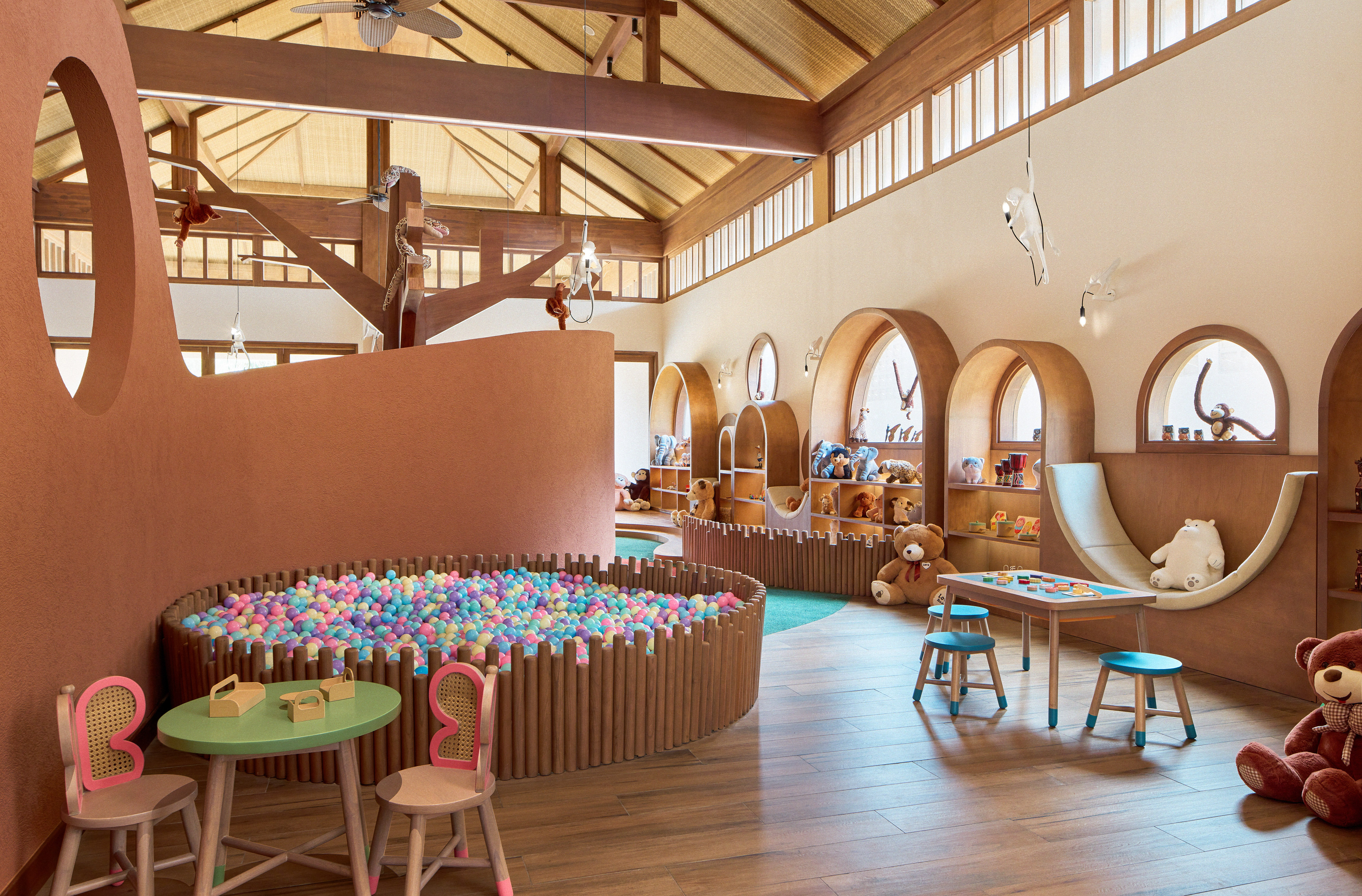 a room with a play area and a play slide