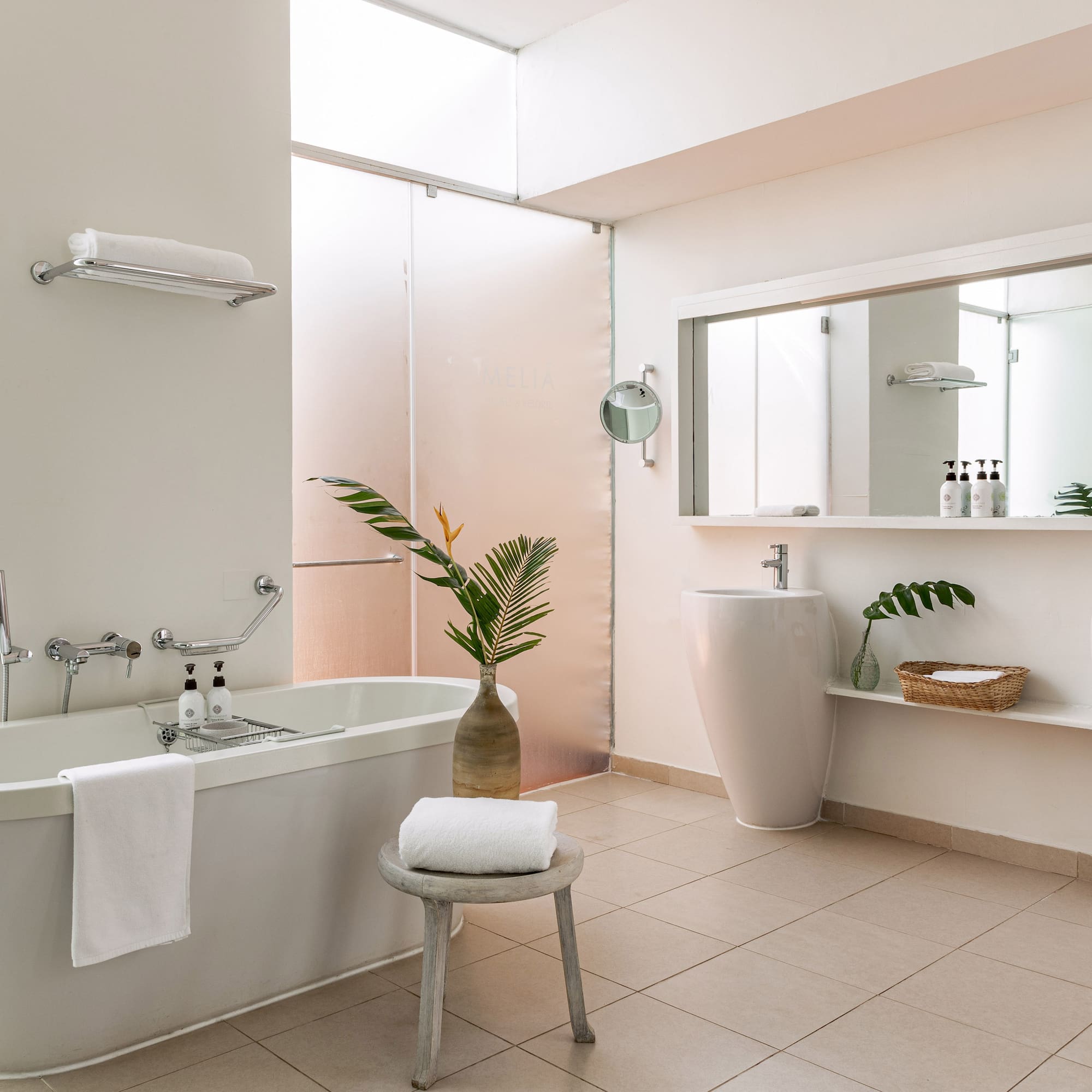 a bathroom with a tub and sink