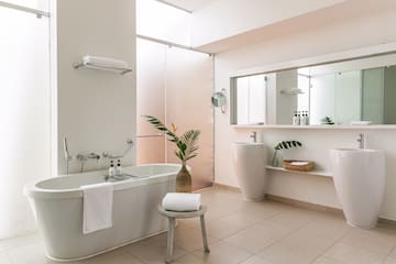 a bathroom with a tub and sink