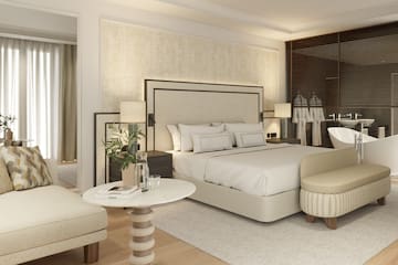 a bedroom with a bed and a table