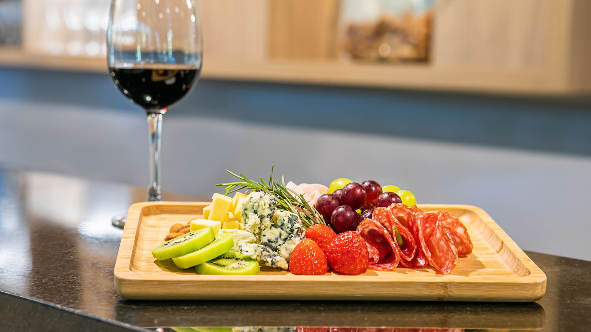 a plate of food and a glass of wine