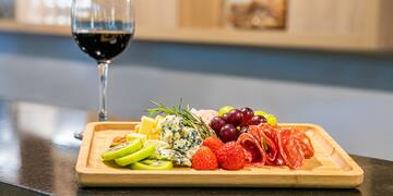 a plate of food and a glass of wine