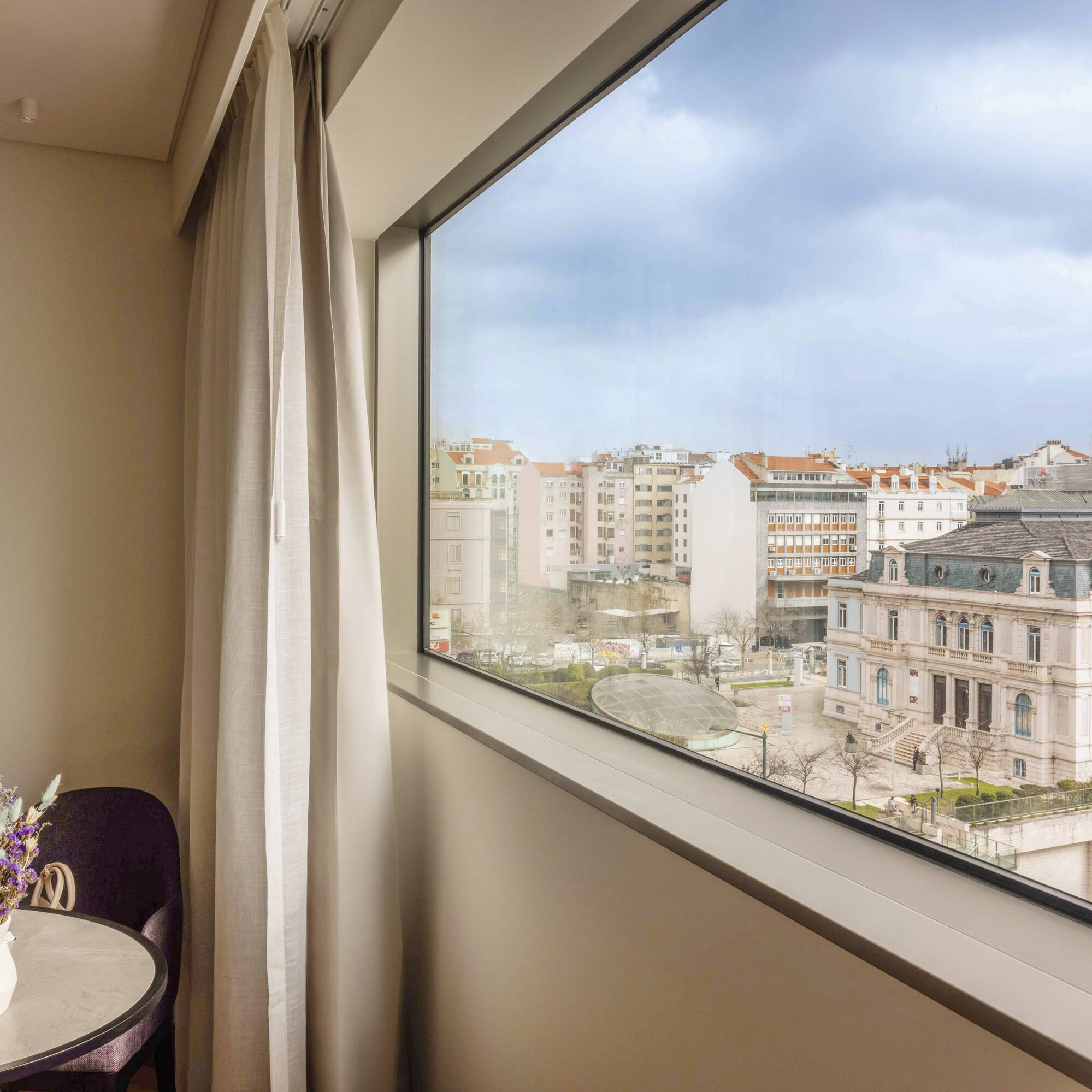 a window with a view of a city