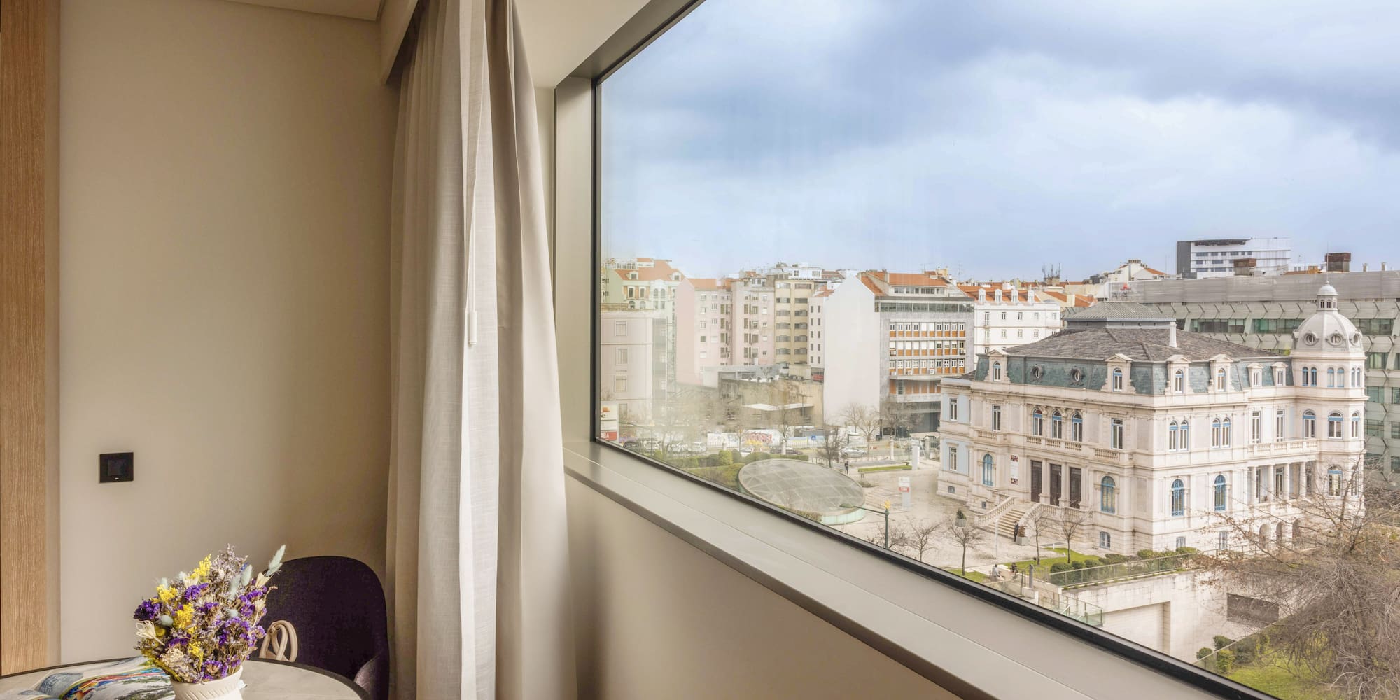 a window with a view of a city