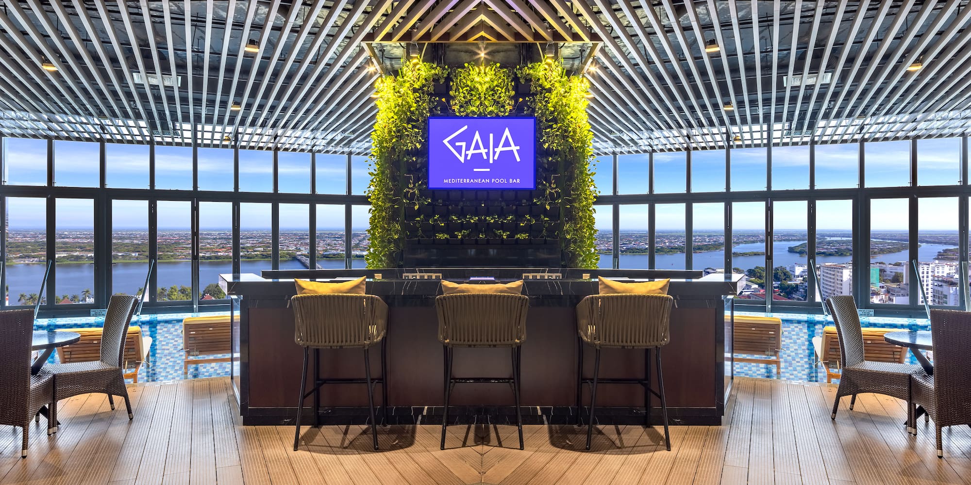 a bar with chairs and a tv in the middle