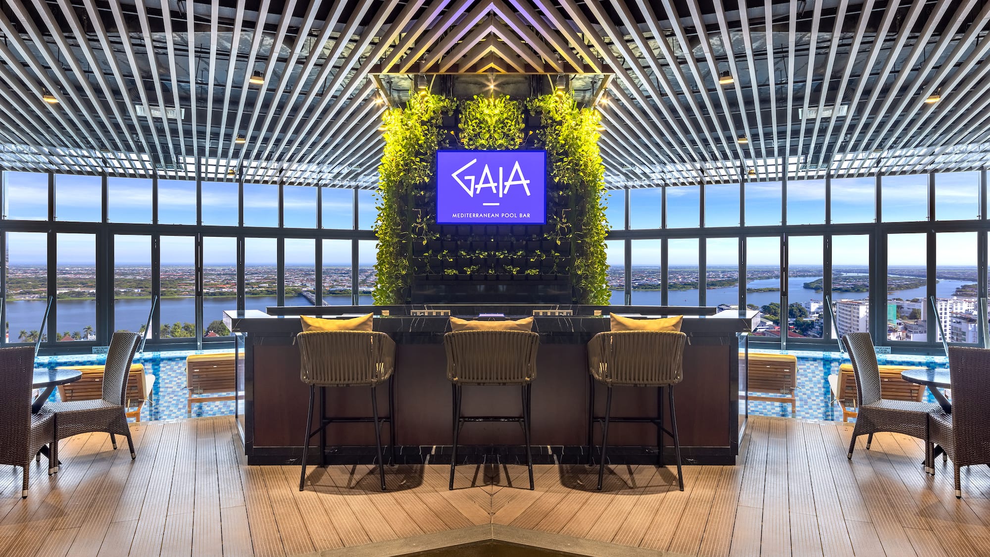 a bar with chairs and a tv in the middle