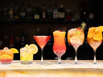 a row of different colored drinks