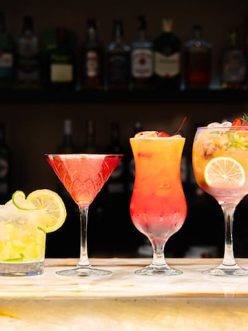 a row of different colored drinks