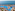 Tropical resort water park, pools, elephant statues, ocean view.
