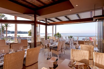 a restaurant with a view of the ocean