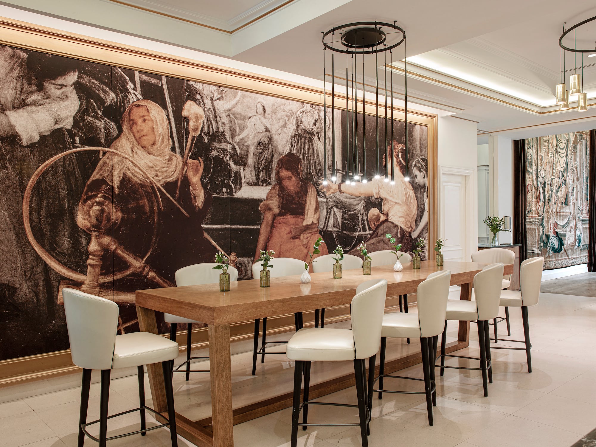 a room with a large table and chairs