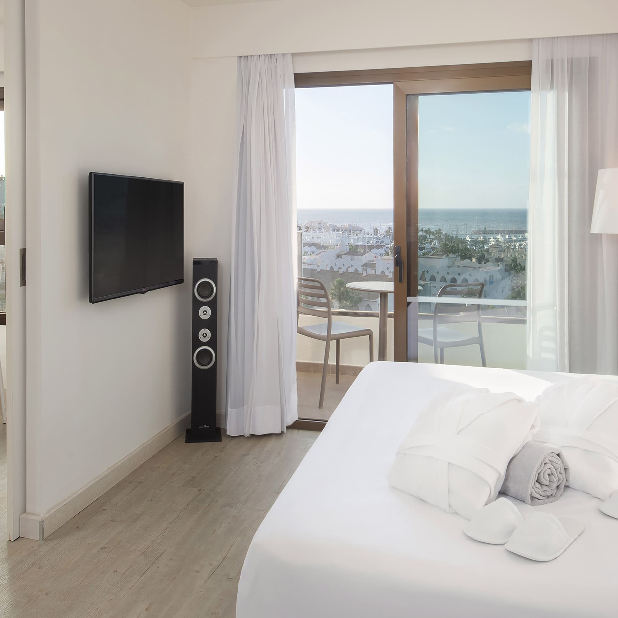 a bedroom with a television and a bed