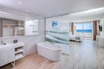 a bathroom with a bathtub and a mirror