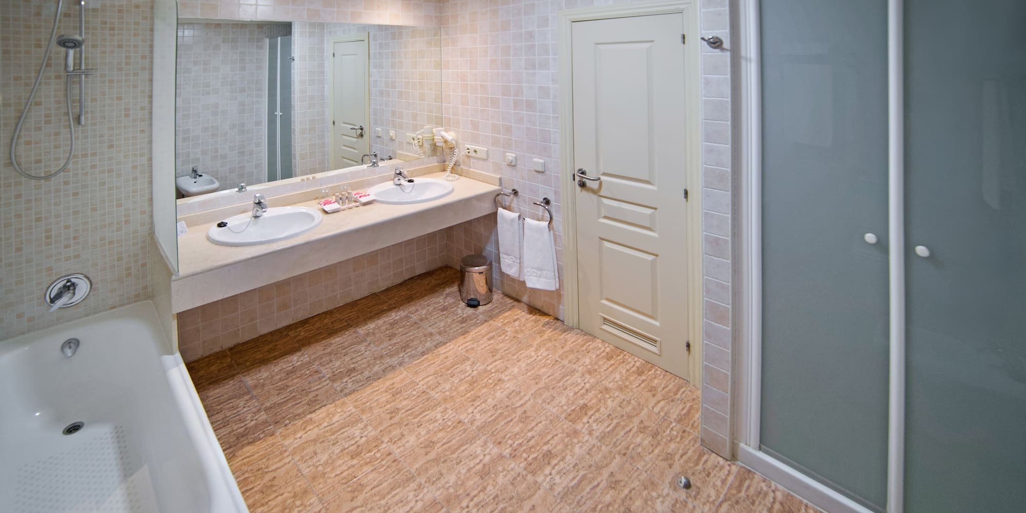 a bathroom with a shower and sink