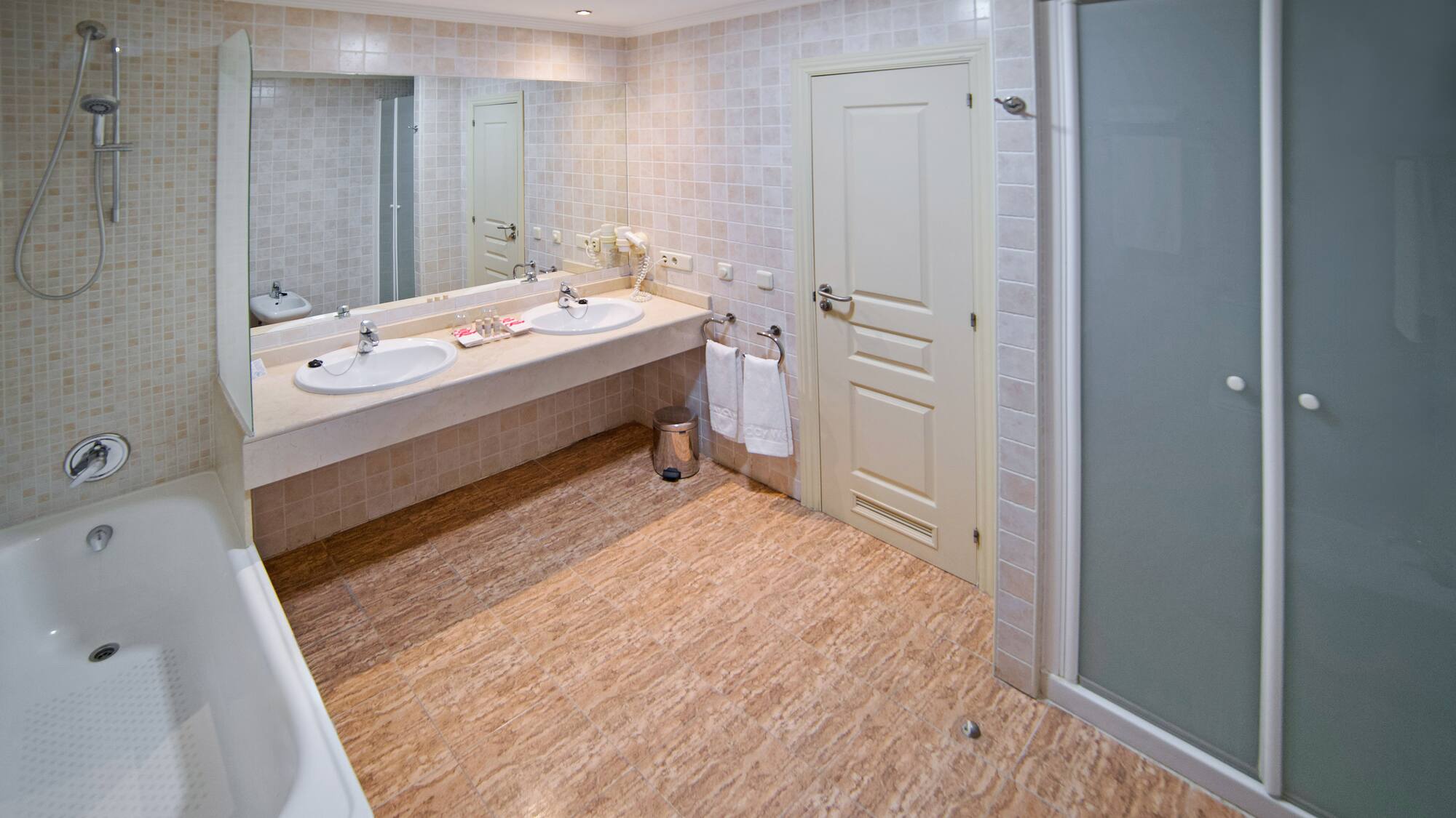 a bathroom with a shower and sink