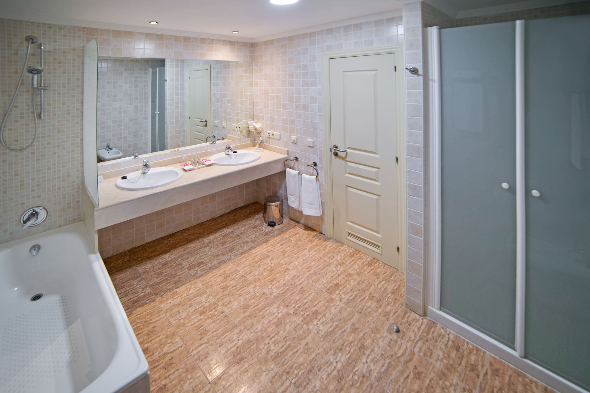 a bathroom with a shower and sink