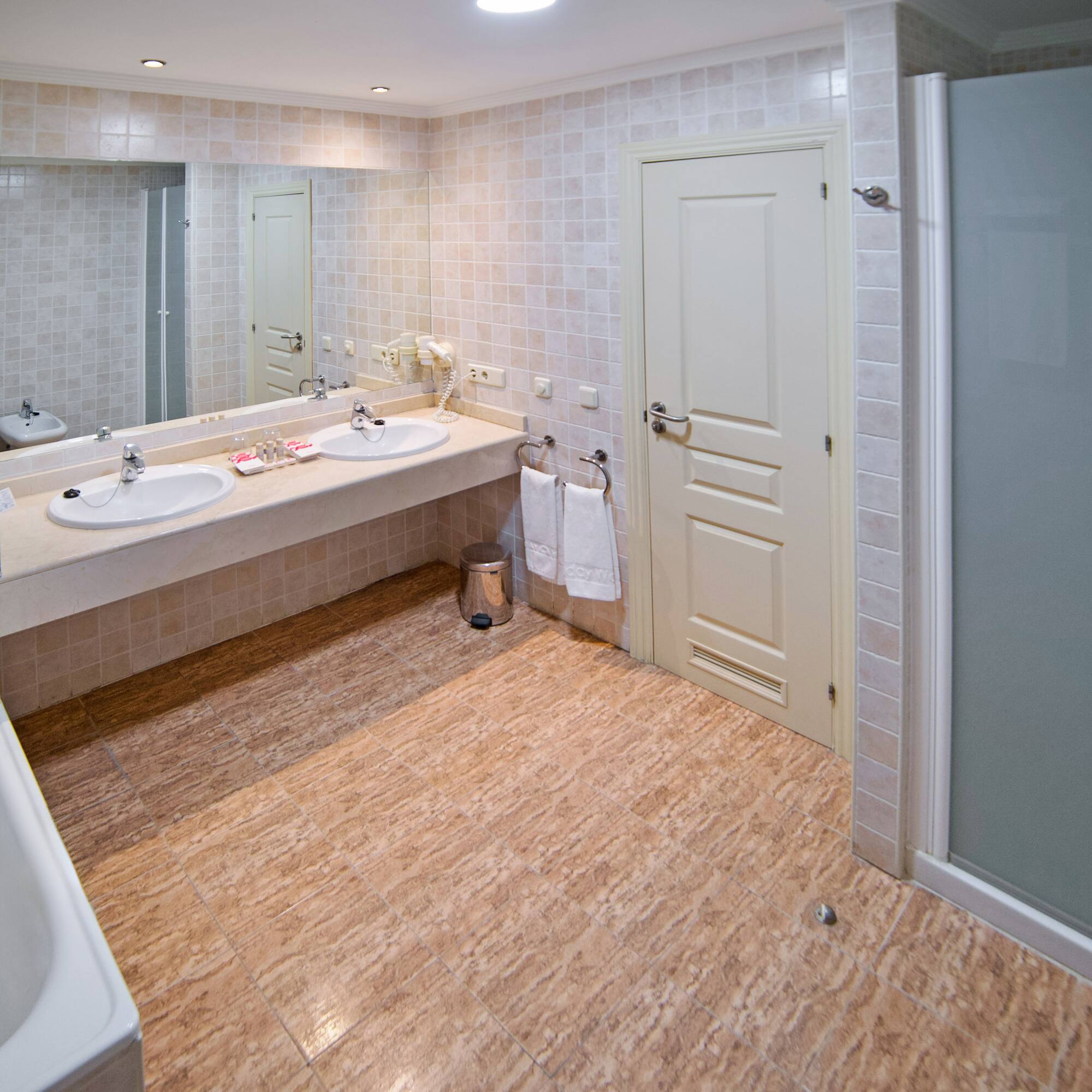 a bathroom with a shower and sink